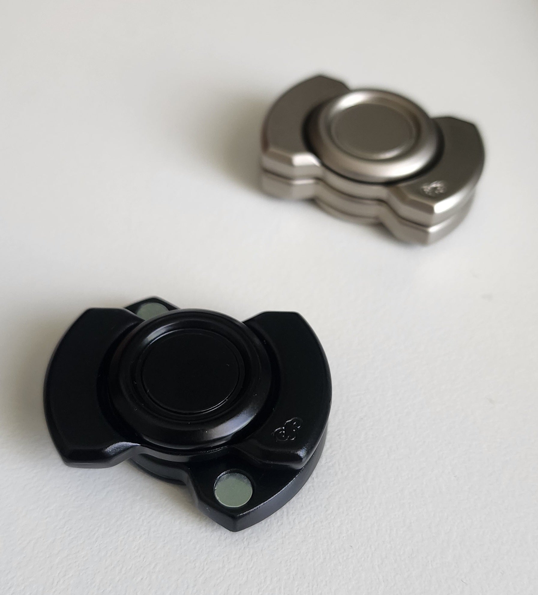Magnetic Spin, Click & Glide Fidget – Metal Slider Disc (Black & Silver)