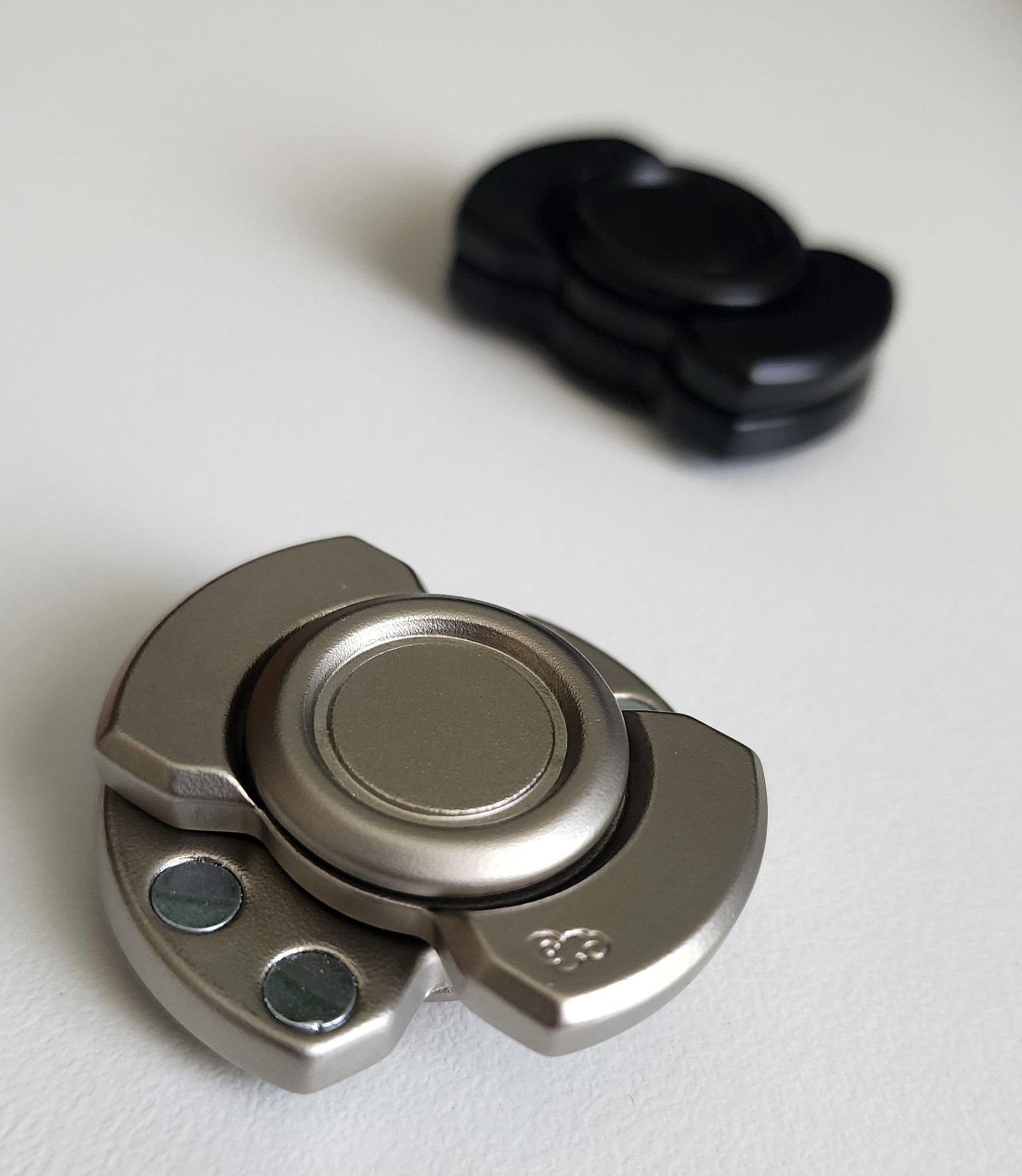 Magnetic Spin, Click & Glide Fidget – Metal Slider Disc (Black & Silver)