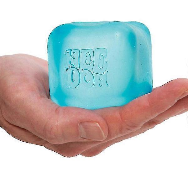 Blue squishy cube 'Nee Doh' branding held in a hand against a white background