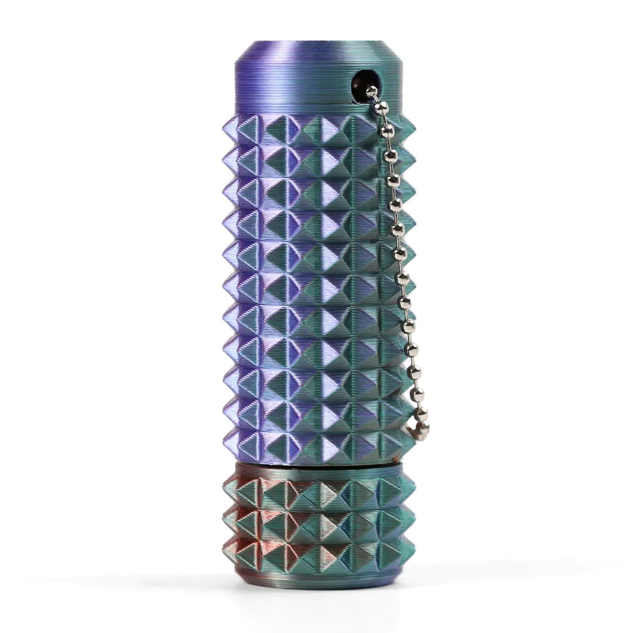 Multicolored textured spikey sensory fidget spinnerwith pyramid patterns on a white background