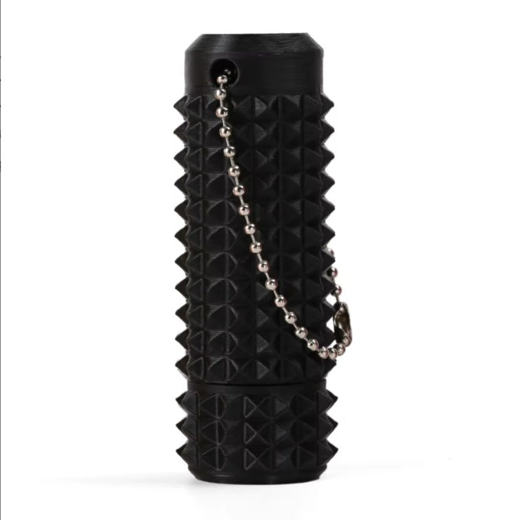 Black spiked fidget sensory tool with a chain on a white background